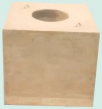 Square precast tundish block with a round opening and lifting loops