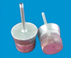Two composite porous plugs with steel housings and gas inlet pipes